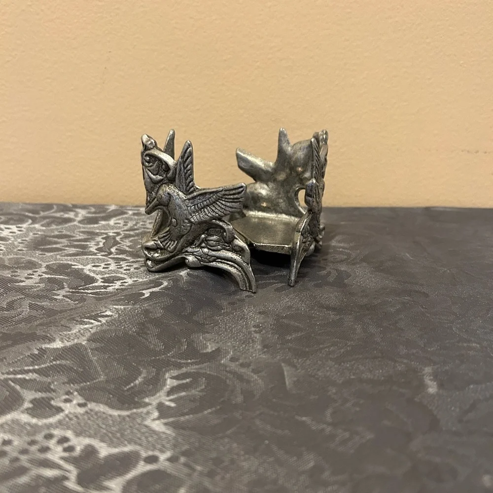 Pewter candle holder features hummingbirds and hearts